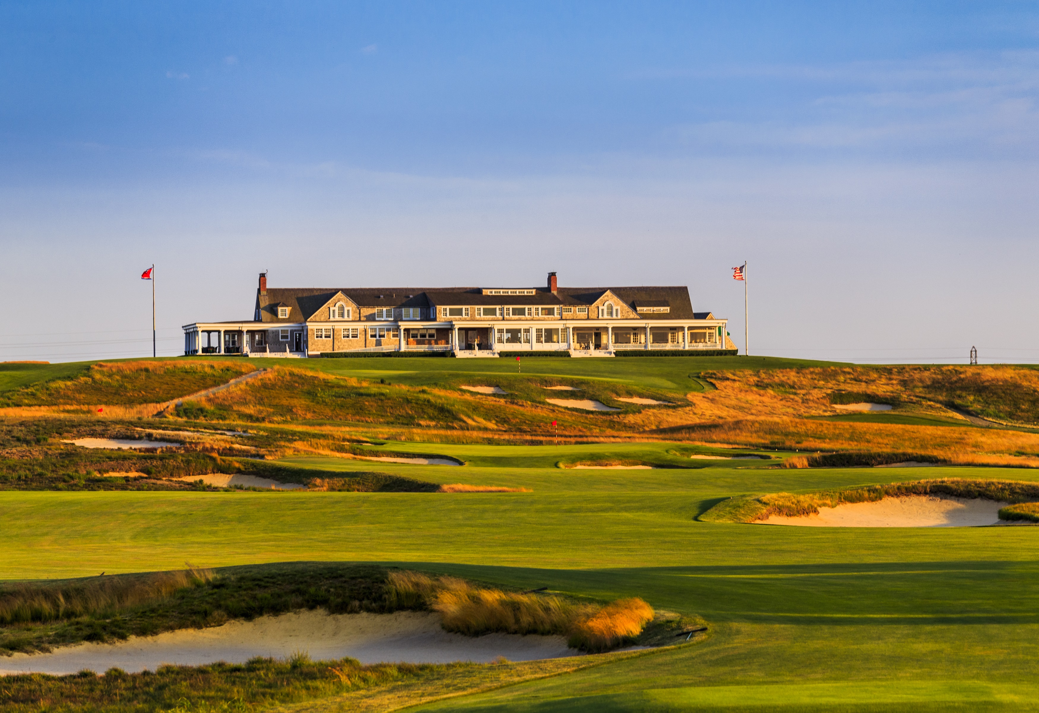 Illustrated championship cup above a navy course horizon and bunker shapes.